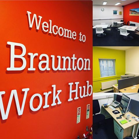 Welcome to Braunton Work Hub on orange wall, collage of photos of offices painted in bright colours
