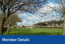 Member details button, Braunton Recreation Ground, grassed playing field with trees in the foreground