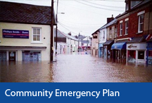 Community Emergency Plan button, Deep flood water in Caen Street Braunton with shops flooded